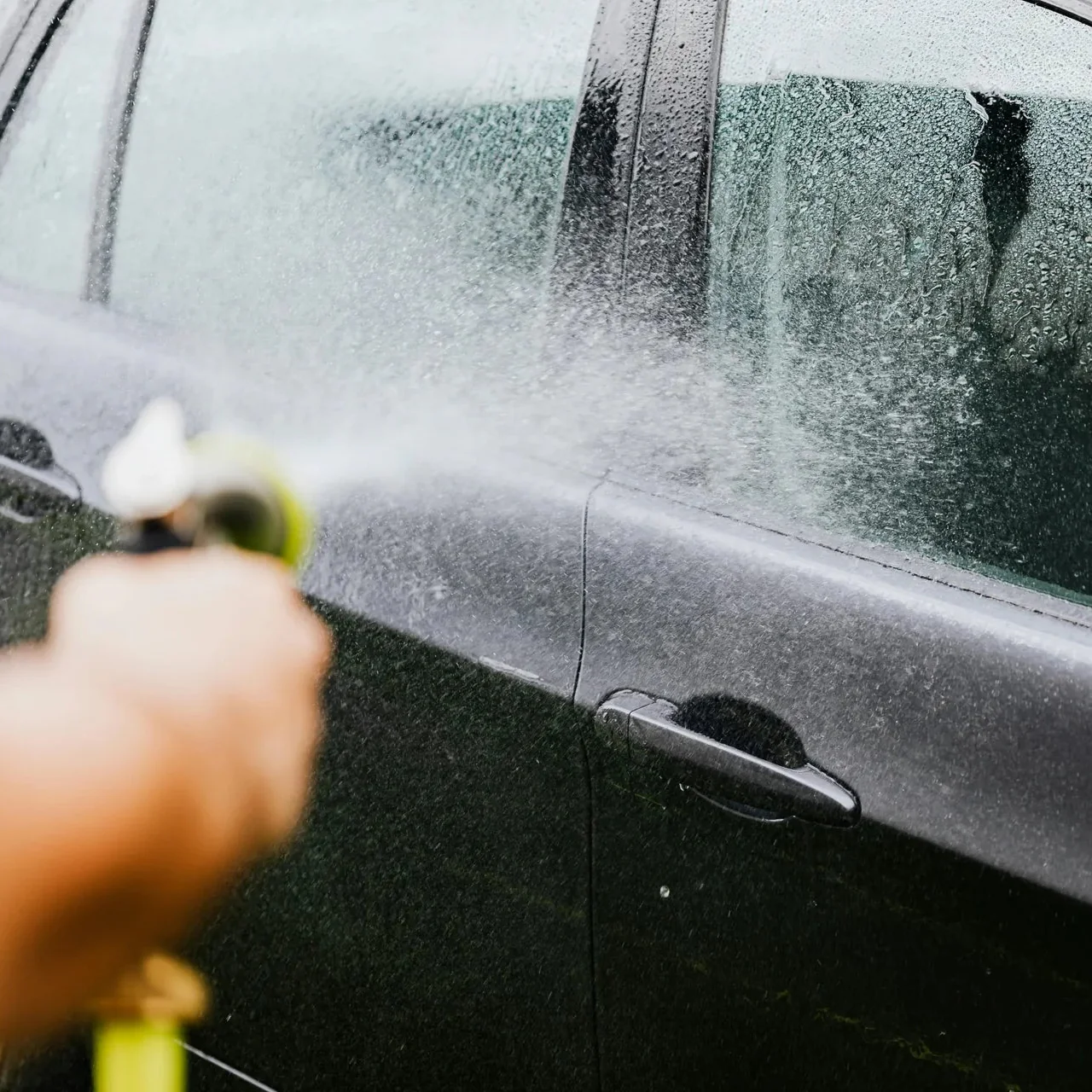 Exterior detailing calgary technician performing foam wash on vehicle at Stance Bros